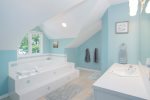 Primary bathroom with both a jetted tub and walk in shower